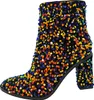 A single black ankle boot covered in colorful sequins. Produktbild-Vorschau