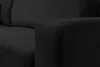 A close-up view of the armrest and seat of a black corduroy sofa. Voir les images du produit