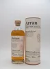 A bottle of Arran Single Malt Scotch Whisky and its cylindrical packaging are displayed against a white background. Produktbild-Vorschau