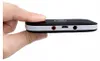 A hand is holding a small black electronic device with white trim, showing its side ports. Náhľad obrázku produktu