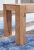 Close-up of the wooden legs of a bench on a patterned rug. Anteprima dell’immagine prodotto