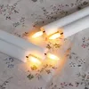 12 candele a LED a forma di bastoncino, luce bianco caldo, Anteprima dell’immagine prodotto 4