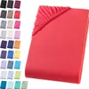 A collection of colorful fitted sheets displayed on a white background, with one red sheet prominently featured in the foreground. Produktbild-Vorschau
