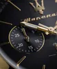 A close-up shot of a black and gold Maserati watch face, showing the brand logo and a sub-dial. Produktbild-Vorschau