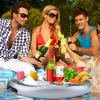 People enjoying drinks and snacks on a floating tray in a swimming pool. Náhled obrázku produktu