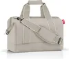 A studio shot of a beige duffel bag with white trim and straps. Anteprima dell’immagine prodotto