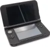 A black Nintendo 3DS XL handheld game console is shown open on a white background. Produktbild-Vorschau
