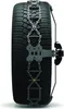 A close-up side view of a car tire with snow chains installed. Produktbild-Vorschau