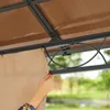 A close-up view of a person's hand adjusting a beige curtain on a gazebo. Produktbild-Vorschau