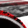 A close-up view of the edge of a rug, showing the texture and layers of the material. Voir les images du produit