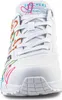 Close-up front view of a white Skechers sneaker with colorful abstract paint splatters and branding on the tongue. Voir les images du produit