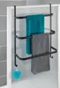 A black metal towel rack with three bars, hanging on a shower door. Two towels, one teal and one gray, are draped over the bars. A teal bath pouf hangs from a hook on the rack. Náhled obrázku produktu