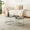 A living room scene with a couch, plant, and two nesting coffee tables. Produktbild-Vorschau