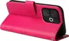 A pink flip phone case with floral accents is shown from a side angle, with the case open to reveal the phone inside. Produktbild-Vorschau