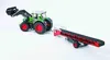 A toy tractor with a front loader and a conveyor belt trailer, shown against a white background. Náhled obrázku produktu