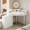 A white corner vanity table with a lighted mirror and makeup accessories, placed in a room with a window and a bed. Produktbild-Vorschau