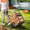 A person is pushing a cart full of firewood outdoors. Podgląd zdjęcia produktu