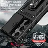 A black phone case with a ring holder and camera cover is shown in a dynamic, rocky environment, suggesting durability and protection. Produktbild-Vorschau