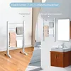 A split image showing a freestanding electric towel warmer on the left and a wall-mounted electric towel warmer in a bathroom setting on the right. Produktbild-Vorschau