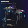 A gaming desk with RGB lighting and weights on top, highlighting its stability and load capacity. Náhľad obrázku produktu