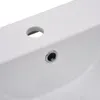 A close-up view of a white ceramic sink with a drain and a faucet hole. Produktbild-Vorschau