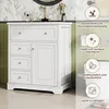 A white bathroom vanity cabinet with drawers and a door, shown in a bathroom setting with floral wallpaper and green tiled walls. Informational icons and text are overlaid on the right side. Podgląd zdjęcia produktu