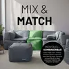 A modular sofa system with a pouf in a living room setting. Náhled obrázku produktu