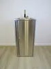 A stainless steel washbasin with a faucet and a cabinet underneath, set against a white wall and on a wooden floor. Podgląd zdjęcia produktu