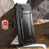 A rugged phone case with a kickstand is displayed on a rocky, outdoor surface. Náhled obrázku produktu