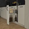 A kitchen cabinet pull-out drawer with bottles and kitchen items inside. Produktbild-Vorschau