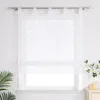 A white Roman blind with a branch pattern hangs on a window. Produktbild-Vorschau