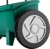 A close-up view of a green wheeled spreader. Podgląd zdjęcia produktu
