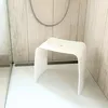 A white acrylic shower stool in a modern bathroom. Produktbild-Vorschau