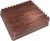 A stack of interlocking foam mats with a dark wood grain pattern. Náhľad obrázku produktu