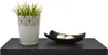 A black shelf with a potted plant and a decorative bowl with two candles. Náhled obrázku produktu