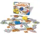 A board game with road pieces, vehicles, and tokens spread out on a white surface, with the game box in the background. Produktbild-Vorschau