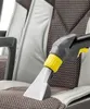 A close-up of a vacuum cleaner upholstery attachment being used on a car seat. Náhľad obrázku produktu