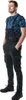 A man wearing black overalls and a blue camouflage t-shirt, standing with his hands in his pockets. Náhled obrázku produktu