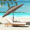 Two lounge chairs on a beach with a large umbrella providing shade. Náhled obrázku produktu