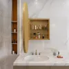 A bathroom vanity with a sink, faucet, and a medicine cabinet filled with toiletries. Náhled obrázku produktu