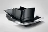 A black and silver coffee machine accessory is shown on a white background. Anteprima dell’immagine prodotto