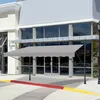 A gray awning is installed in front of a building's entrance. Náhľad obrázku produktu