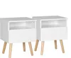 Two white nightstands with wooden legs are shown against a white background. Náhľad obrázku produktu