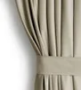 A close-up view of a beige curtain with a pleat and a tie-back. Produktbild-Vorschau