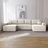 A U-shaped sectional sofa in a light beige corduroy fabric is shown in a well-lit living room with a large abstract artwork on the wall. Náhľad obrázku produktu