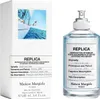 A Maison Margiela Replica Sailing Day Eau de Toilette bottle and its packaging are displayed side-by-side against a white background. Voir les images du produit