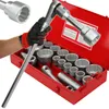 A hand wearing a glove holds a large socket wrench, with a red toolbox filled with various sockets in the background. Produktbild-Vorschau