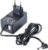 A black power adapter with a coiled black cable and a circular connector. Náhľad obrázku produktu