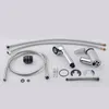 A collection of plumbing parts, including hoses, a faucet handle, a shower head, and various connectors, laid out on a white background. Produktbild-Vorschau
