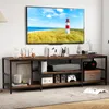 A TV stand with a TV and various items on and around it in a living room setting. Náhľad obrázku produktu